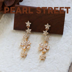 Boucles d'oreilles pendantes en laiton doré et zircon, motif fleur | Pompon floral en cristal