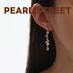 Boucles d'oreilles pendantes en laiton doré et zircon, motif fleur | Pompon floral en cristal