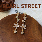 Boucles d'oreilles pendantes en laiton doré et zircon, motif fleur | Pompon floral en cristal