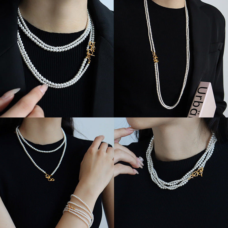 Collier de perles à double rang avec fermoir à bascule en forme de cœur 