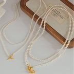 Collier de perles à double rang avec fermoir à bascule en forme de cœur 