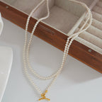 Collier de perles à double rang avec fermoir à bascule en forme de cœur 