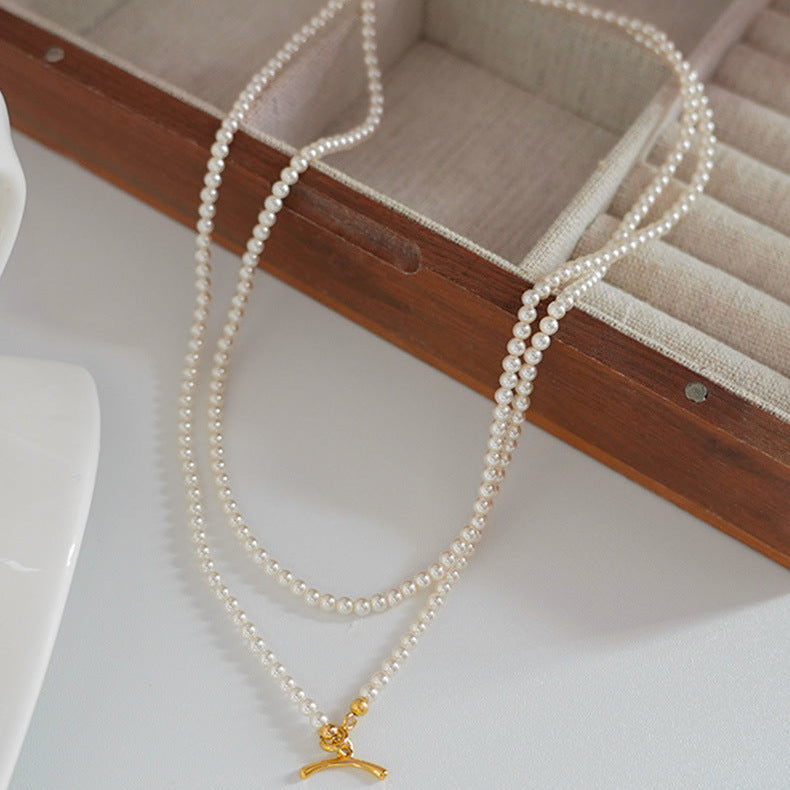 Collier de perles à double rang avec fermoir à bascule en forme de cœur 