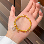 Bracelet de perles luxueux à plusieurs breloques | Or et cristal 