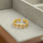 Bague ajustable à maillons marguerite en cristal délicat | Bague florale dorée 