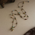 Collier pendentif chien ballon fantaisiste avec perles turquoise 