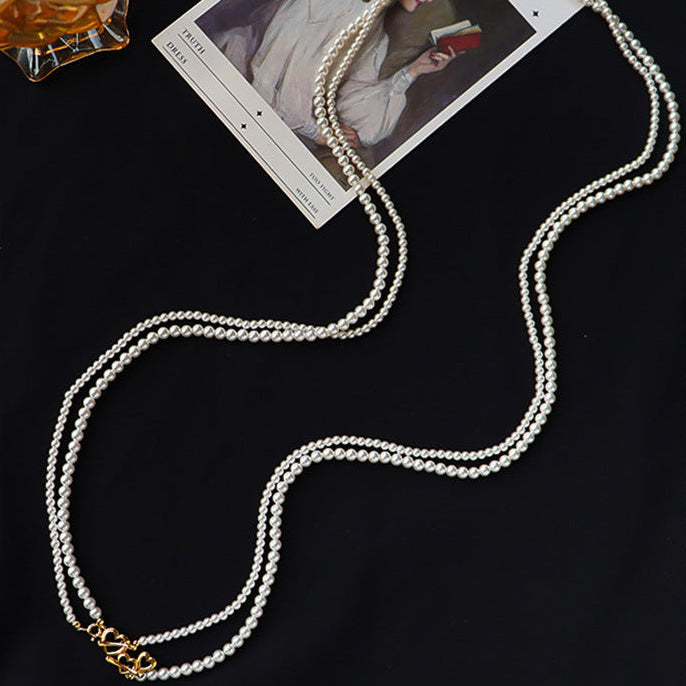 Collier de perles à double rang avec fermoir à bascule en forme de cœur 