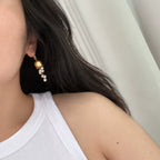 Boucles d'oreilles à pompon en perles de muguet | Finition mate