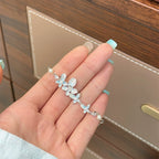 Bracelet coulissant fantaisie en émail bleu avec papillon et fleurs 