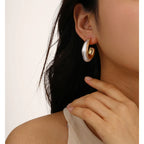 Boucles d'oreilles sculpturales double créoles en perles et or