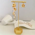 Boucles d'oreilles asymétriques en perles de muguet 