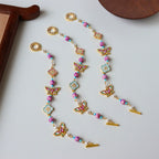 Bracelet artisanal en émail avec perles papillon et trèfle 